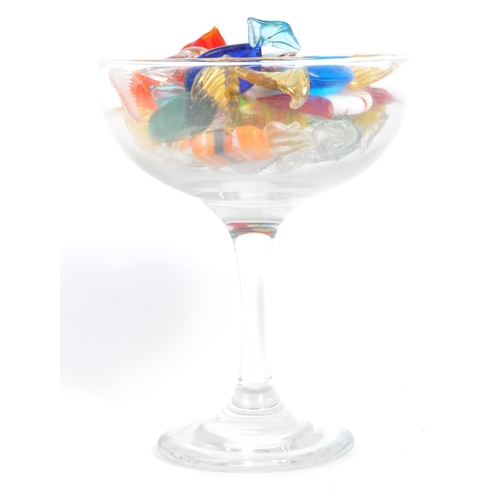 13 - A collection of 19 mainly Murano glass sweets with twisted ends in a variety of colours and sizes, m... 