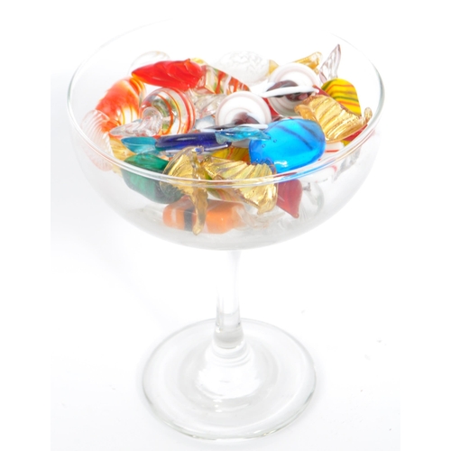 13 - A collection of 19 mainly Murano glass sweets with twisted ends in a variety of colours and sizes, m... 