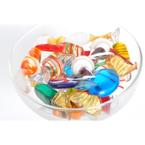 13 - A collection of 19 mainly Murano glass sweets with twisted ends in a variety of colours and sizes, m... 