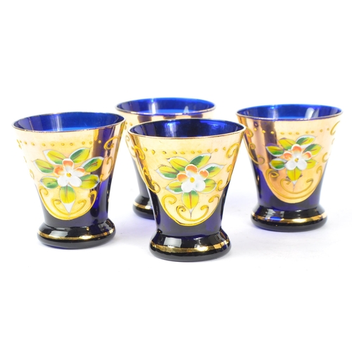 16 - Two Czech Bohemian art glass decanters and glasses in cobalt blue, with hand painted / applied gilt ... 