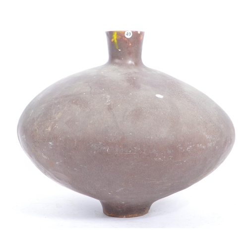 20 - A large mid 20th century brutalist narrow neck studio pottery vase. Of squat stone glaze form with t... 