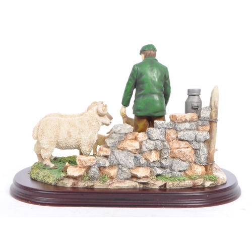 326 - The Leonardo Collection - Two late 20th century figurines. Depicting a farmer with a collie sheep do... 
