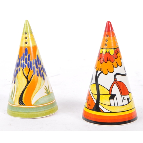 33 - Clarice Cliff - A pair of hand painted sugar sifters by Clarice Cliff. Includes 'House & Bridge', th... 