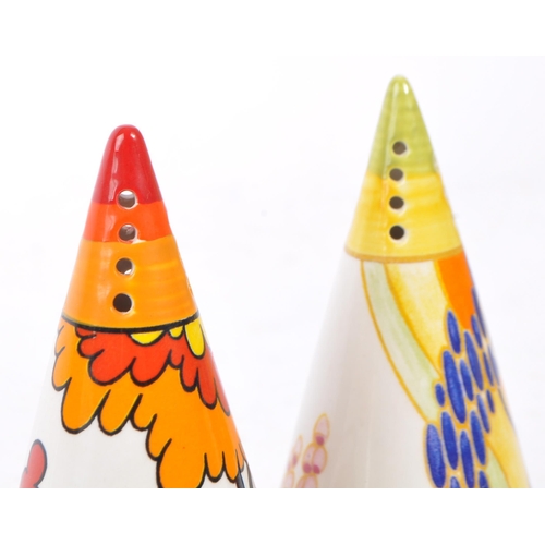 33 - Clarice Cliff - A pair of hand painted sugar sifters by Clarice Cliff. Includes 'House & Bridge', th... 