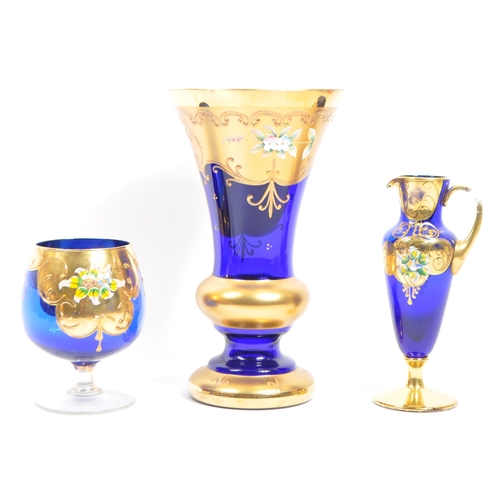 35 - A large collection of Czech Bohemian art glass (20 plus pieces) in cobalt blue, with hand painted / ... 