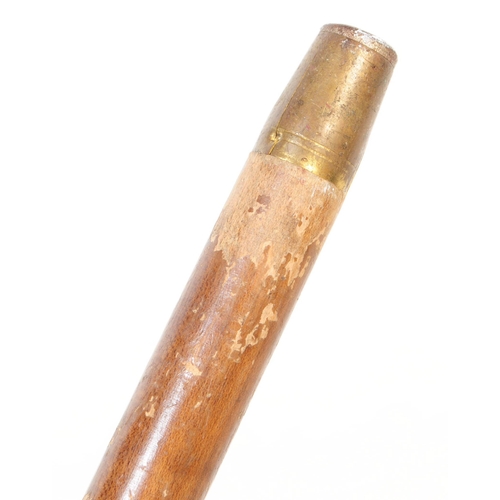 363 - A 20th century walking stick having handle carved in the from of a dogs head with amber glass bead e... 