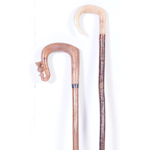 364 - A collection of early 20th century and later walking sticks to include a example with carved horse h... 