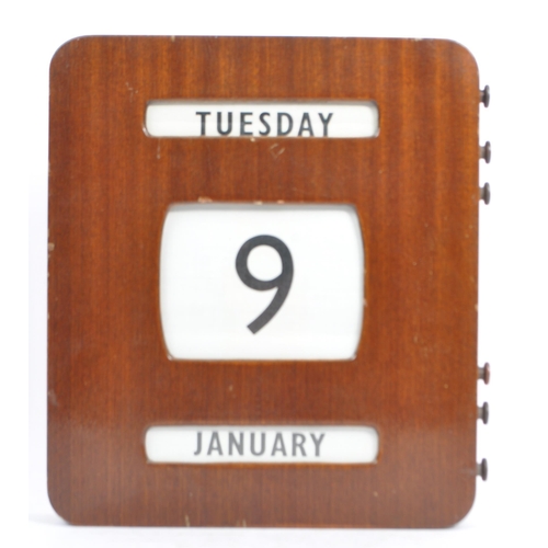 366 - A mid 20th century oak veneer perpetual wall calendar. The calendar being of square form with canvas... 