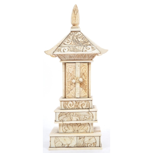 368 - A 19th century Meiji period bone carving of a Pagoda tiered tower. With intricate carved detail of f... 