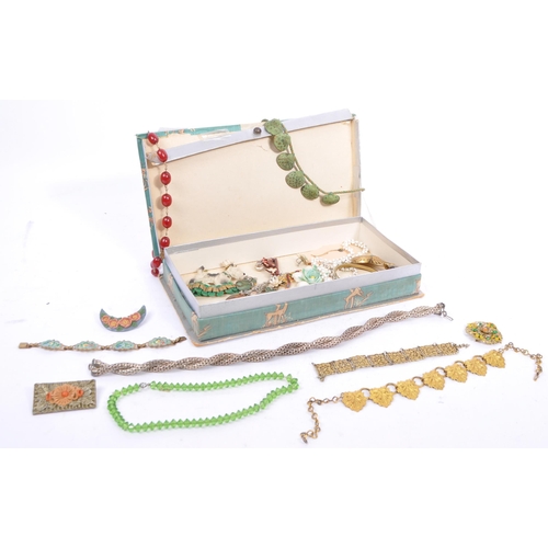 369 - A varied range of 20th century brooches, necklaces in a variety of materials which includes an item ... 