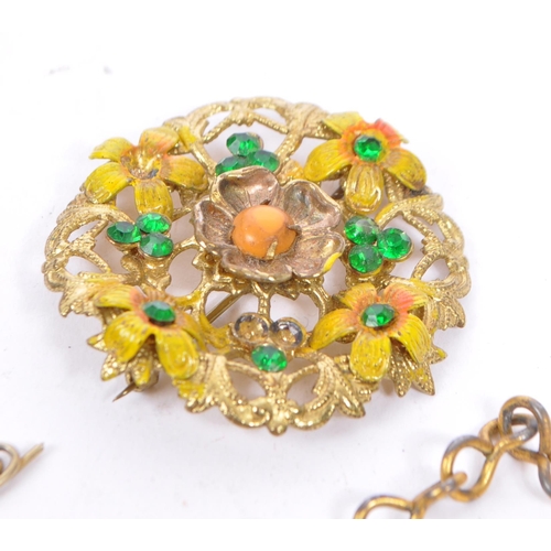 369 - A varied range of 20th century brooches, necklaces in a variety of materials which includes an item ... 