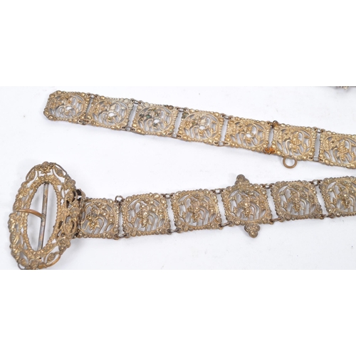 374 - A collection of 19th century and later chatelaine belts. To include two Victorian silver tone Chatel... 