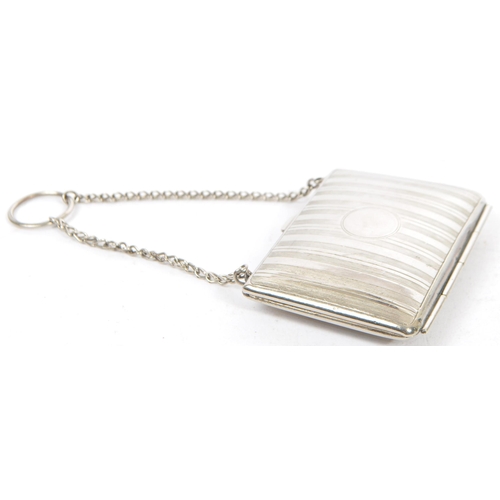 376 - Three vintage silver plated coin purses. The lot to include a purse of rectangular form and having r... 