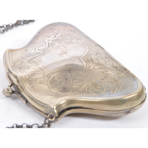 379 - Two silver plated purses. One having an etched scrolled design with central vacant cartouche. The  o... 