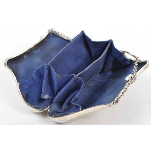 379 - Two silver plated purses. One having an etched scrolled design with central vacant cartouche. The  o... 