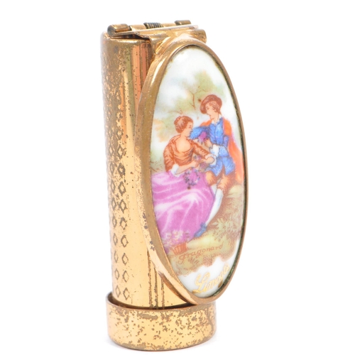 381 - A Vintage Patrys Limoges Lipstick holder and Agme compact. The Swiss made compact having a gold tone... 