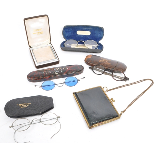 385 - A collection of early 20th century and later vintage eyewear and accessories. To include two pairs o... 