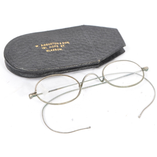 385 - A collection of early 20th century and later vintage eyewear and accessories. To include two pairs o... 