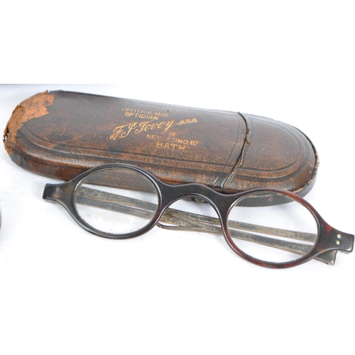 385 - A collection of early 20th century and later vintage eyewear and accessories. To include two pairs o... 