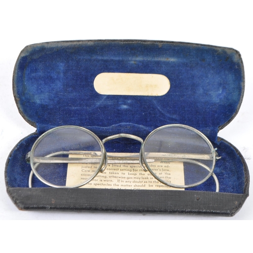 385 - A collection of early 20th century and later vintage eyewear and accessories. To include two pairs o... 