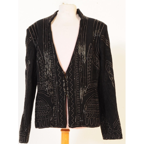 387 - A Bolongaro Trevor utility hand beaded jacket. The black blazer being made of 100% wool with 100% co... 