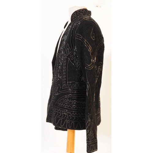 387 - A Bolongaro Trevor utility hand beaded jacket. The black blazer being made of 100% wool with 100% co... 