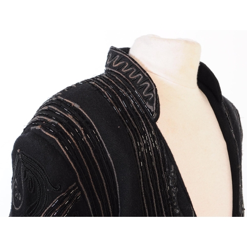 387 - A Bolongaro Trevor utility hand beaded jacket. The black blazer being made of 100% wool with 100% co... 