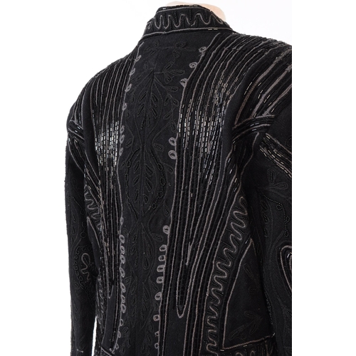 387 - A Bolongaro Trevor utility hand beaded jacket. The black blazer being made of 100% wool with 100% co... 