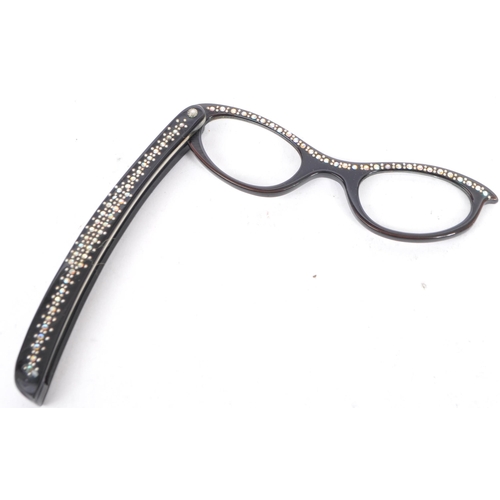 388 - A collection of early 20th century and vintage eyewear. To include a cased antique Lorgnette and pai... 