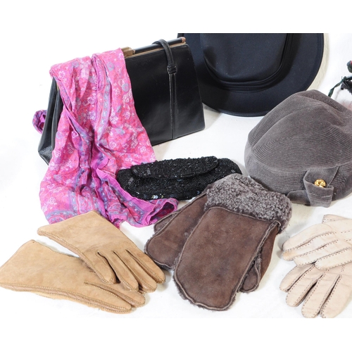 390 - A collection of vintage 20th century ladies fashion pieces to include hats, gloves, scarves, bags. T... 