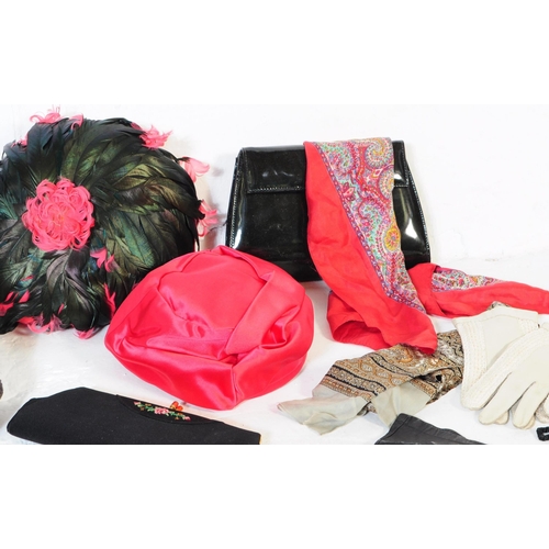 390 - A collection of vintage 20th century ladies fashion pieces to include hats, gloves, scarves, bags. T... 