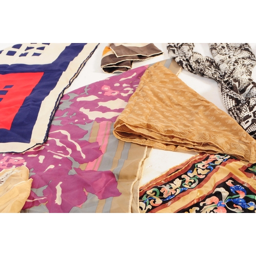 394 - A collection of vintage scarves and a handkerchief. The lot to include a hand rolled and stitched we... 