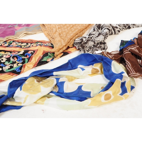 394 - A collection of vintage scarves and a handkerchief. The lot to include a hand rolled and stitched we... 