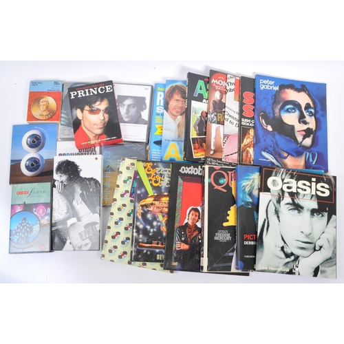 411 - A collection of music memorabilia to include books, DVD's, CD's, VHS Video & magazines; To include '... 