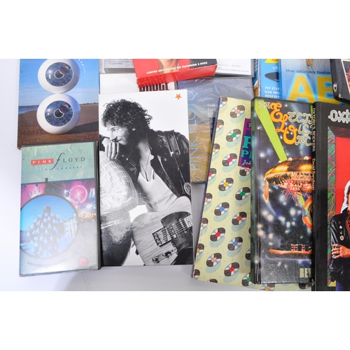 411 - A collection of music memorabilia to include books, DVD's, CD's, VHS Video & magazines; To include '... 