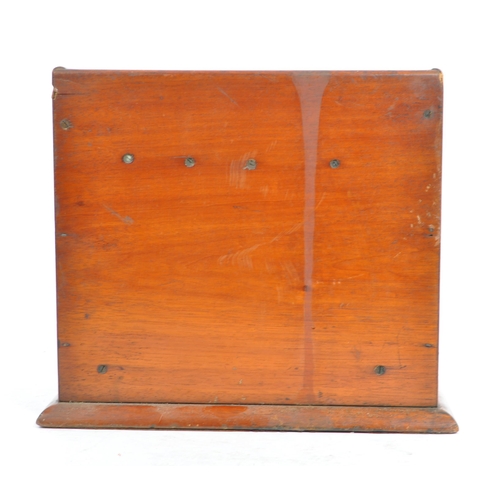 420a - An early 20th century mahogany wood letter rack. Of rectangular form, with mahogany wooden frame par... 