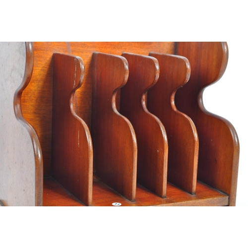 420a - An early 20th century mahogany wood letter rack. Of rectangular form, with mahogany wooden frame par... 
