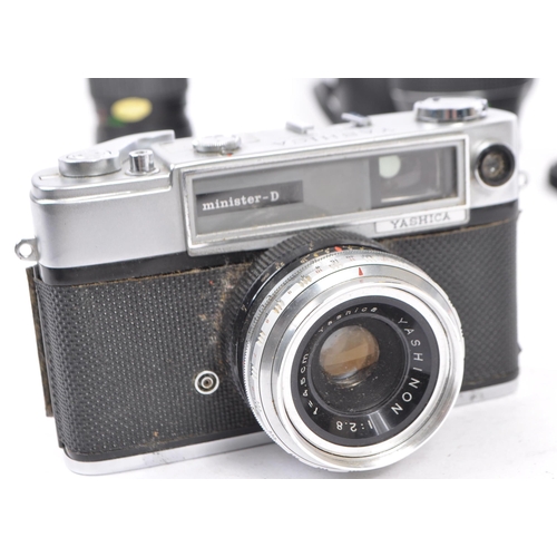 450 - A collection of vintage 20th century 35mm cameras and lenses. The lot to include a Yashica Minister-... 