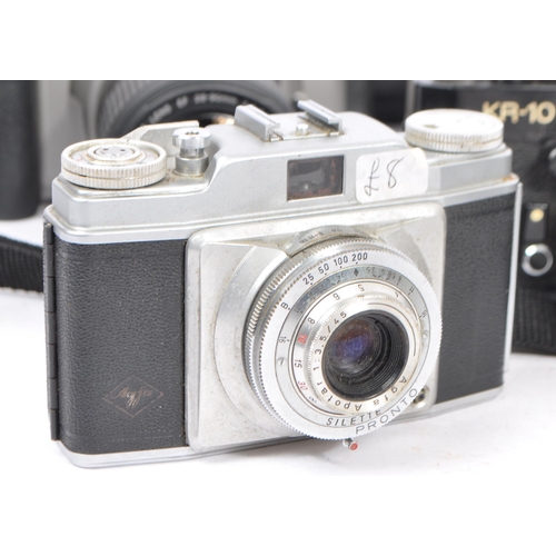 453 - A large collection of 20th century 35mm cameras. The lot to include a Canon EOS 3000N 35mm SLR camer... 