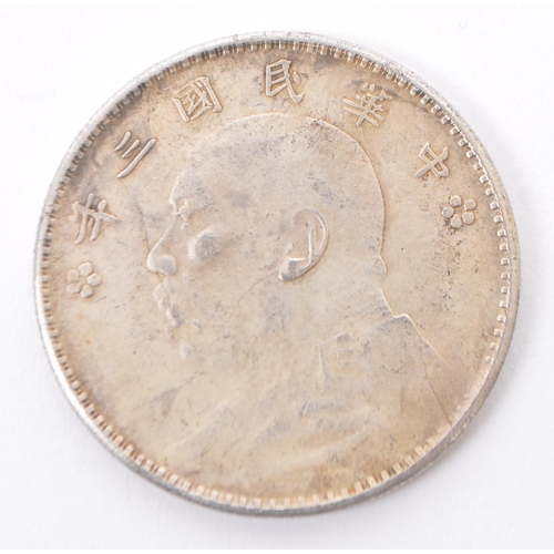 522 - A Chinese silver Yuan coin, 'Fat-Man' Circa 1921 circulated silver dollar coin along with four buria... 