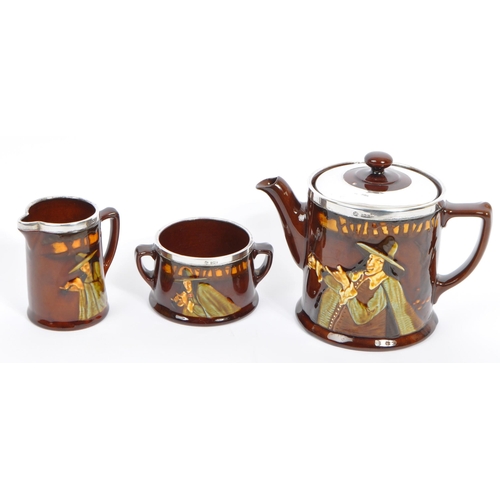 67 - Royal Doulton - An early 20th century circa 1920s Royal Doulton pied piper pattern part tea service.... 