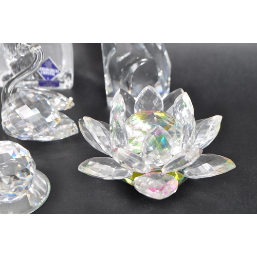 7 - Swarovski - A collection of Swarovski and similar crystal figurines to include two large swans, two ... 