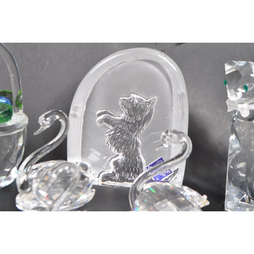 7 - Swarovski - A collection of Swarovski and similar crystal figurines to include two large swans, two ... 