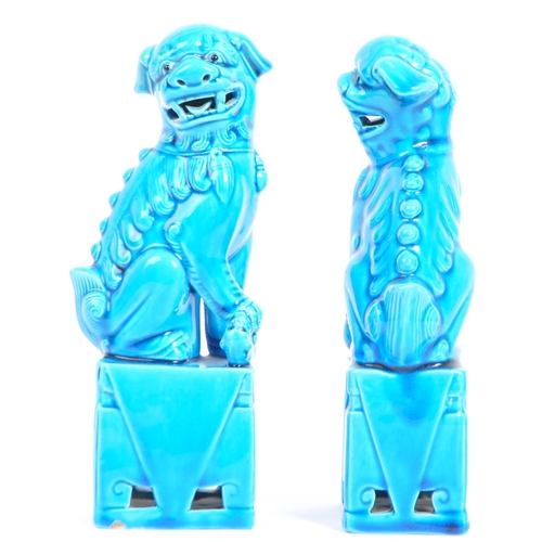 71 - A pair of 20th Century Chinese  / Oriental figural foo dogs. The temple lions  raised on pedestal ba... 