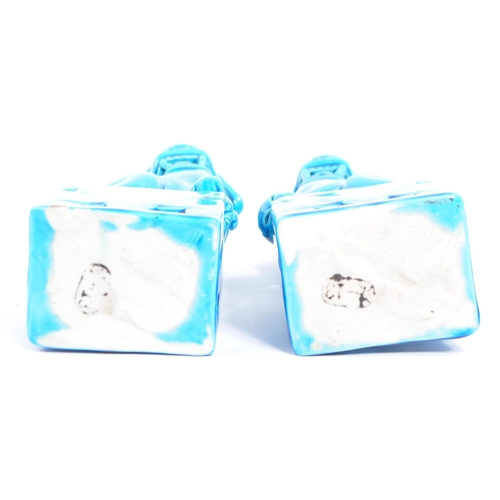 71 - A pair of 20th Century Chinese  / Oriental figural foo dogs. The temple lions  raised on pedestal ba... 