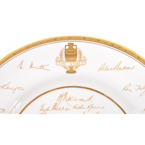 76 - A mid 20th century 1953 Royal Worcester commemorative The Ashes wall plate. The plate having white g... 