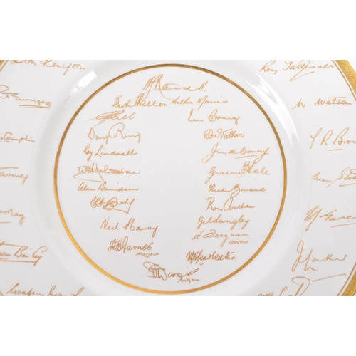 76 - A mid 20th century 1953 Royal Worcester commemorative The Ashes wall plate. The plate having white g... 