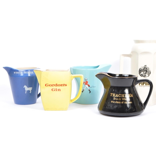 77 - Breweriana - A large collection of vintage mid 20th century advertising whisky / water jugs to inclu... 