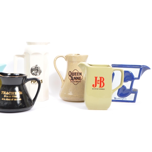 77 - Breweriana - A large collection of vintage mid 20th century advertising whisky / water jugs to inclu... 