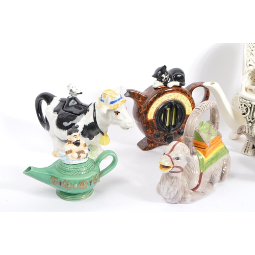 80 - A collection of eight vintage later 20th century novelty teapots. Comprising of a various examples; ... 